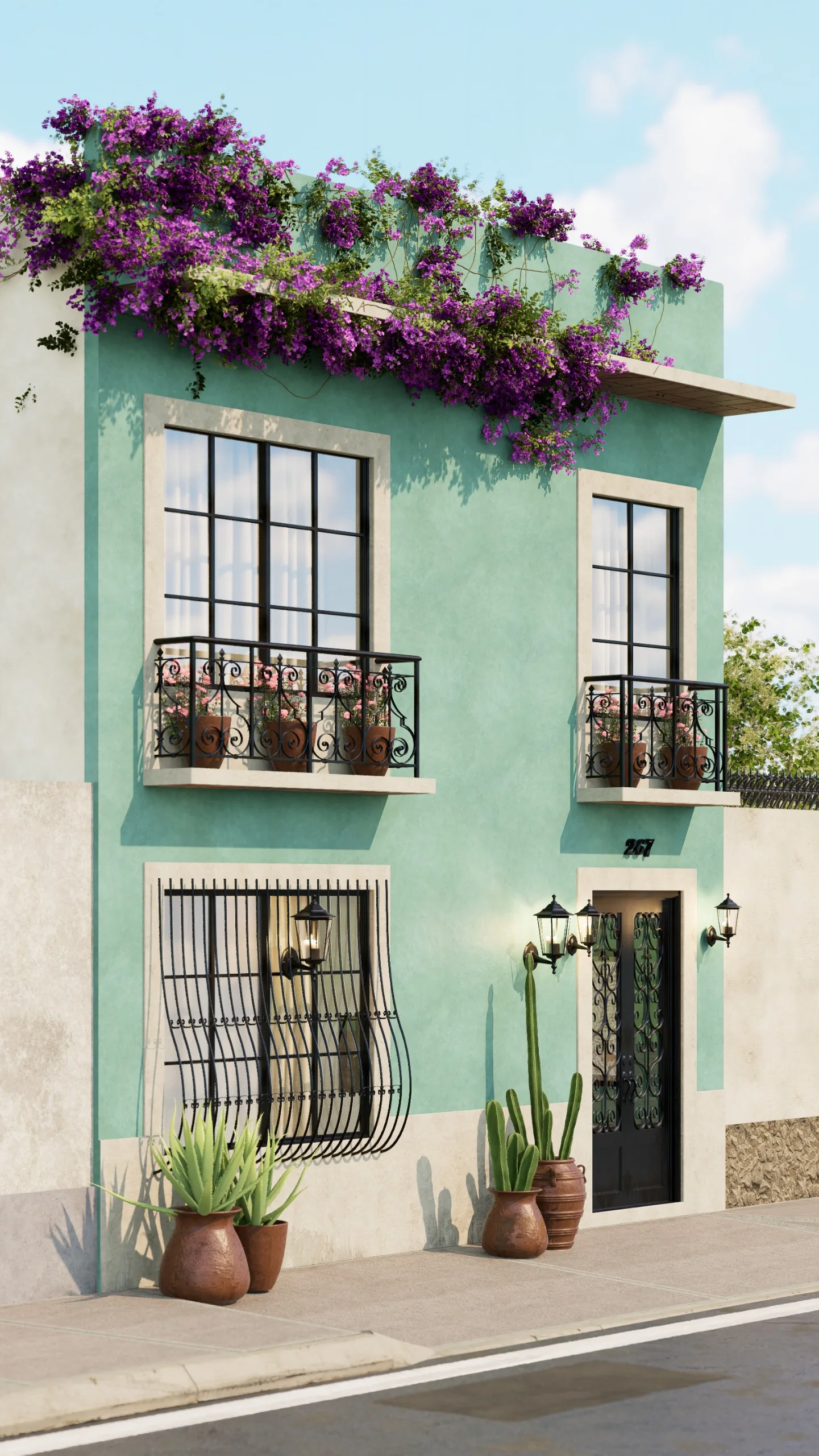 Fachada turquesa de Hacienda Turquesa con balcones de herrería y bugambilias